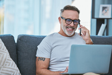 Sticker - I just received some great feedback. Shot of a mature businessman working from home while using his laptop and making a call.