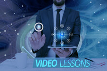 Text Showing Inspiration Video Lessons. Business Concept Online Education Material For A Topic Viewing And Learning Man Holding Screen Of Mobile Phone Showing The Futuristic Technology.