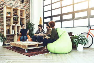 Poster - Put your ideas out there. Shot of a group of young designers having a discussion in a modern office.