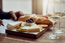 Something To Go With Your Wine. Shot Of A Man Enjoying A Cheese Platter And Tasting Different Wines.