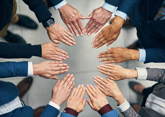 Aufkleber - You cant get to success without having solidarity. High angle shot of a group of businesspeople joining their hands together in unity.