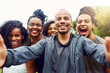 © T Chithambo/peopleimages.com - Friendship brings beautiful memories. Cropped shot of a group of friends posing together for a selfie.