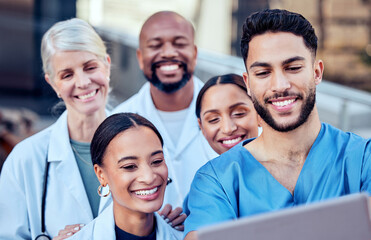 We make a great team. Shot of a group of doctors taking a selfie in the city.