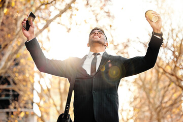 Poster - Yes the deal I was waiting for just got approved. Shot of a young businessman cheering in excitement.