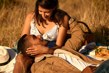 Poster - Getting lost in her eyes. Shot of a young couple on a romantic date outside in nature.