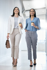 Aufkleber - lets go run this day. shot of two businesswomen carrying coffees while walking through an office.