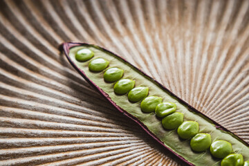 Wall Mural - Open Guaje seed pod on a plate with edible seed in Oaxaca, Mexico.