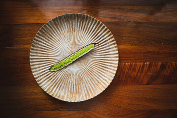 Wall Mural - Open Guaje seed pod on a plate with edible seed in Oaxaca, Mexico.