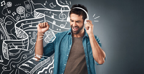 Poster - Jamming out to the music. Studio shot of a handsome young man listening to music while standing beside illustrations against a grey background.