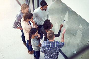 Aufkleber - Planning the way forward. High angle shot of a group of people working in the office.
