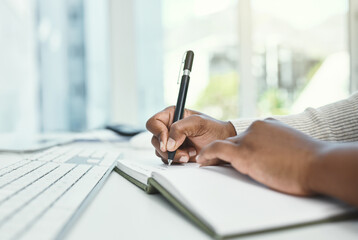 Poster - Write down your daily goals before you start each day. Cropped shot of an unrecognizable businesswoman writing in her notebook while sitting at her desk.