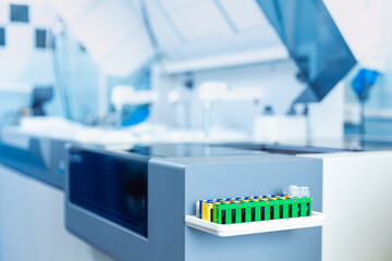 Wall Mural - modern robotical machine for centrifuge testing sample tube with blood. medical laboratory equipment