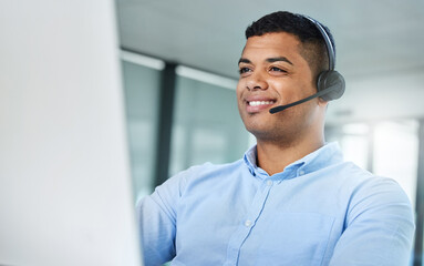 Wall Mural - let me sort that out for you. shot of a handsome young call centre agent sitting in the office and w