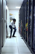 © K Seisa/peopleimages.com - Checking if everything is in place. Cropped shot of a IT technician working and checking if all the servers are up and running.