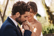 © Tinashe Njaku/peopleimages.com - Im surely the luckiest man on earth. Cropped shot of an affectionate young bridegroom kissing his brides hand while standing outdoors on their wedding day.