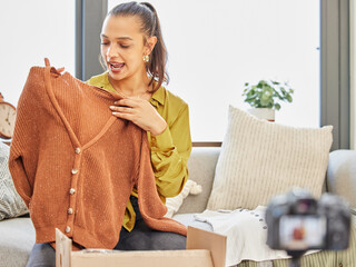 Canvas Print - Ill tell you exactly how to match this up. Shot of a young woman recording a video for her vlog at home.