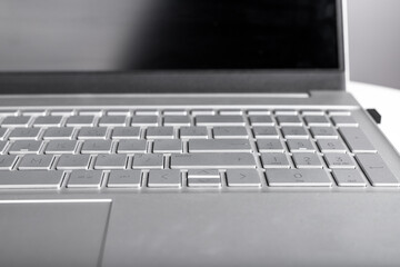 Poster - Grey laptop with keyboard and touchscreen closeup. Electronic device for work, education, relax. High quality photo