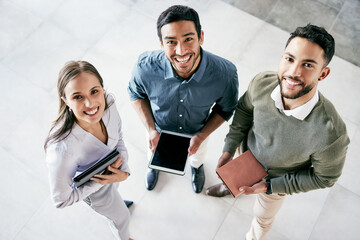 Poster - We can achieve anything as a team. Shot of a diverse group of businesspeople standing together in the office during the day.