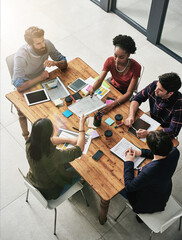 Poster - Sharing information for a successful collaboration. High angle shot of a group of colleagues having a meeting in a modern office.
