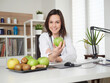 © Stocked House Studio - Professional nutritionist holding a fresh apple