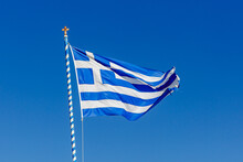 Greek Flag On The Blue Sky Background.