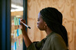 © Katleho Seisa/peopleimages.com - Laying out her ideas. Cropped shot of a young designer writing her ideas on adhesive notes.