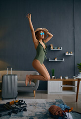 Wall Mural - Woman in swimsuit represent herself on beach