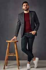 Poster - Meet the king of suave. Studio portrait of a handsome young man posing against a dark background.