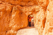 © Tetra Images - United States, Utah, Bryce Canyon National Park, Senior female hiker at rock formation in Bryce Canyon National Park