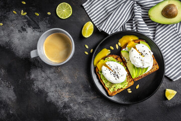 Wall Mural - Healthy Breakfast with Wholemeal Bread Toast and Poached Egg Sandwiches with avocado and poached egg. Healthy food, keto diet, diet lunch concept. Top view