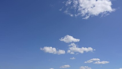 Wall Mural - beautiful early morning sunny sunrise blue sky with fluffy white clouds flying overhead in clear blu