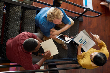 Poster - Sales graph pointing downwards is a problem, we solve problems. Shot of a group of creative workers having a brainstorming session in an office.