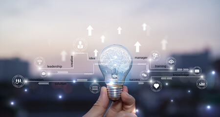 Wall Mural - Businessman holding light bulb, abstract brain and icon digital marketing, strategy and growtn investment business target goal, media and technology.