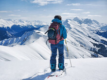 Active Woman Ski Touring On Ski Or Splitboard In Snowy Winter Mountains