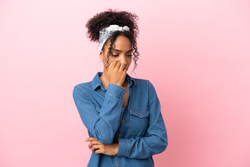 Sticker - Young latin woman isolated on pink background having doubts