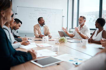 Canvas Print - I thought up this brilliant idea last night. Shot of a group of staff listening to their boss during a business meeting.