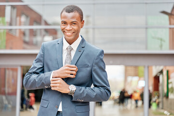 Wall Mural - portrait of successful smiling cheerful african american businessman executive stylish company leader