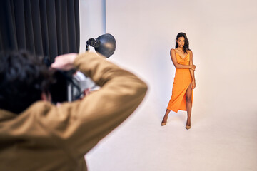 Canvas Print - You are the most beautiful creature. Shot of a photographer taking photos of a model in a studio.