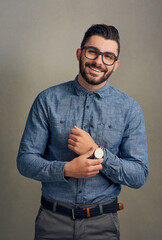 Aufkleber - Doing his thing. Studio portrait of a handsome young man posing against a grey background.