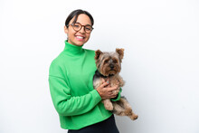 Young Hispanic Woman Holding A Dog Isolated On White Background Smiling A Lot