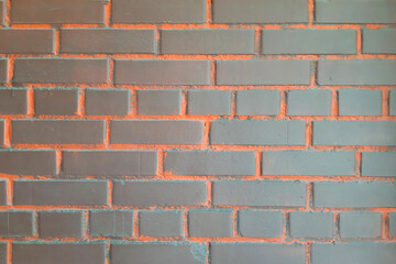 Brick wall background. Bright brown-orange.