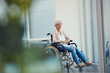 Who knew itd end up like this. Full length shot of a senior woman looking thoughtful while sitting in her wheelchair at a retirement home.