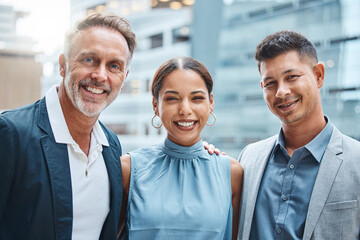 Poster - A supportive team is a strong team. Portrait of a group of businesspeople standing together against a city background.