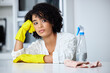 © Michael C/peopleimages.com - This the last thing I feel like doing. Shot of a young woman looking unhappy while cleaning her kitchen.