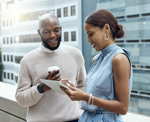 Poster - Monitoring trends as they change by the day. Shot of two businesspeople using a digital tablet together outside an office.