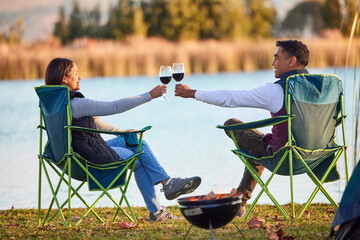 Poster - Camping is therapy. Shot of a young couple having a glass outside while camping outside.