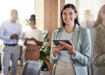 Poster - Taking the time to build a brand. Shot of a young businesswoman using her digital tablet.