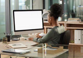 Aufkleber - Shes focused on the task at hand. Rearview shot of an unrecognizable young businesswoman working at her desk in the office.
