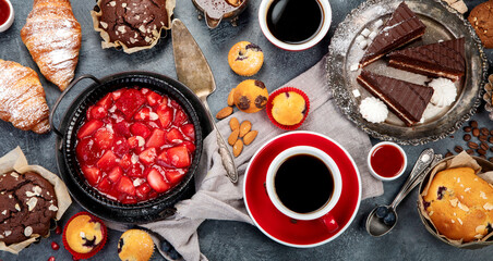 Wall Mural - Dessert table with all kinds of cakes and snacks.