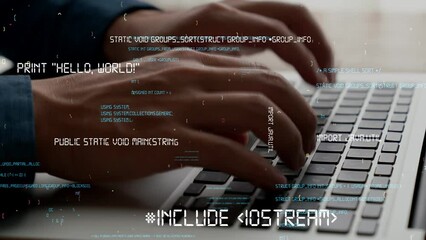 computer programmer uses capable laptop computer to develop programming code of new software . compu